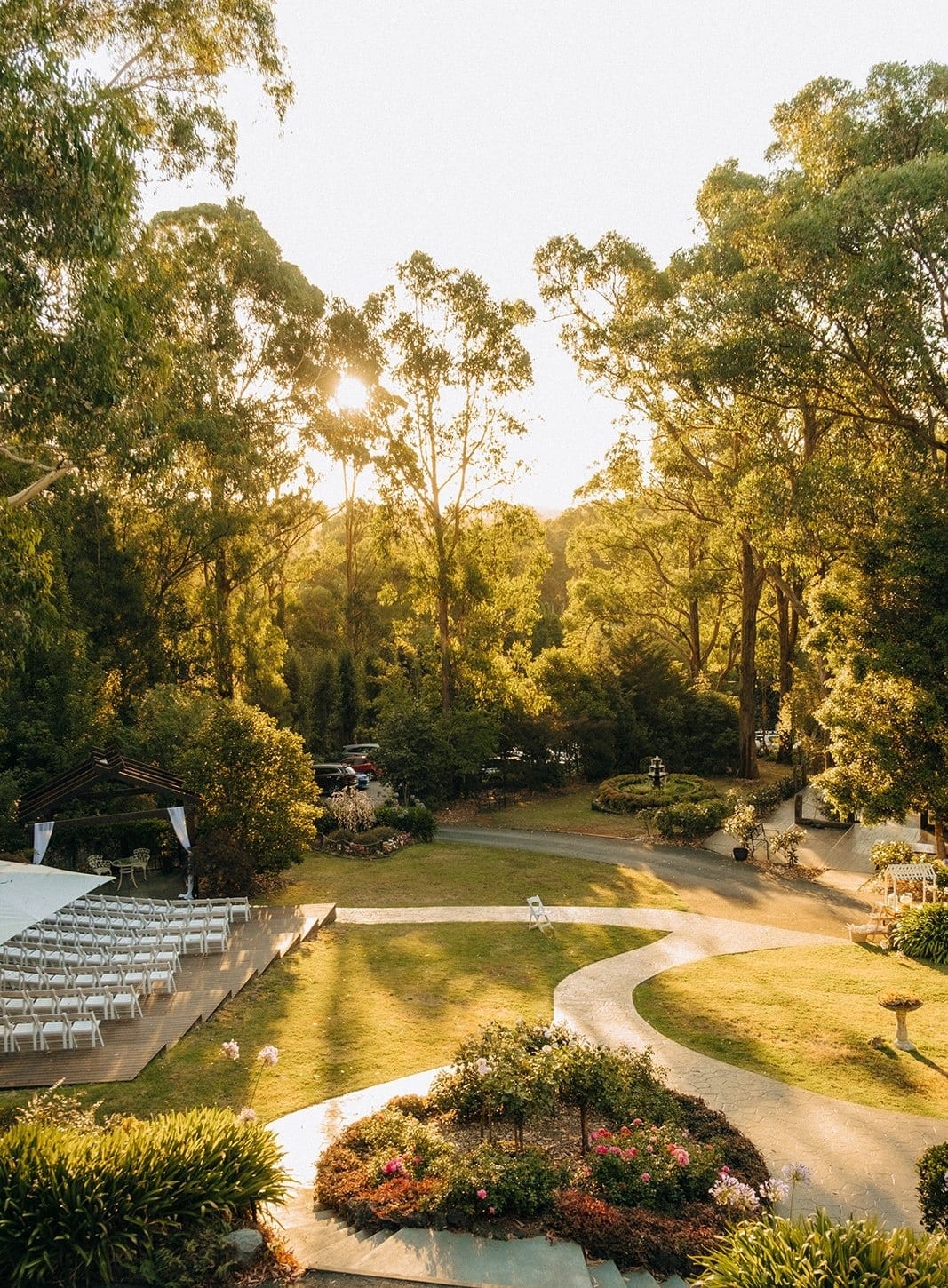 The castle garden and its paths in low evening sun, seen from above