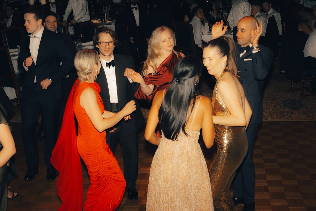 Guests in evening wear dancing on the ballroom floor