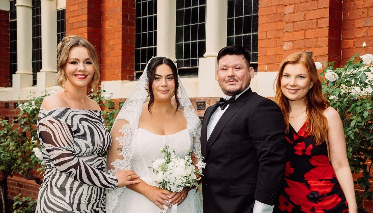 Ashley and Bryan with two friends in a zebra print dress and a red floral dress