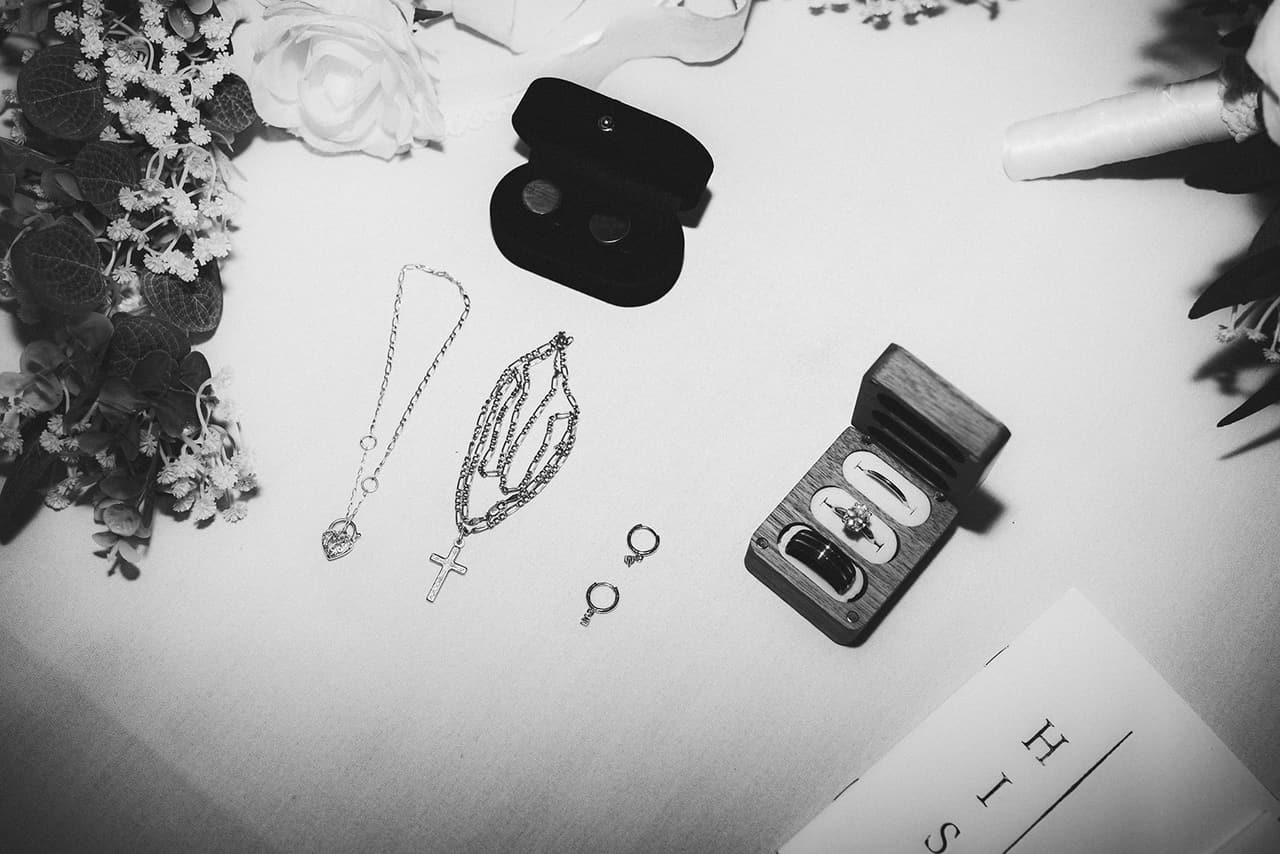 Black and white flat lay of the rings, earrings and jewellery for the day