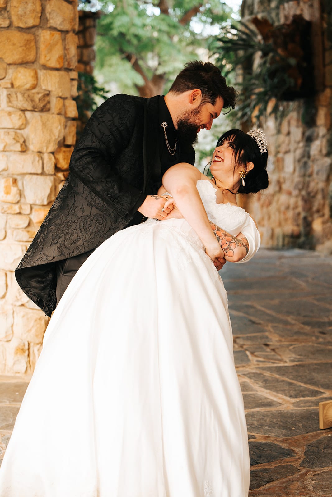 Jordan dipping Porscha during their first dance on the stone terrace
