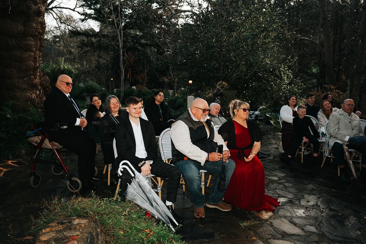 Guests laughing in their seats during the ceremony