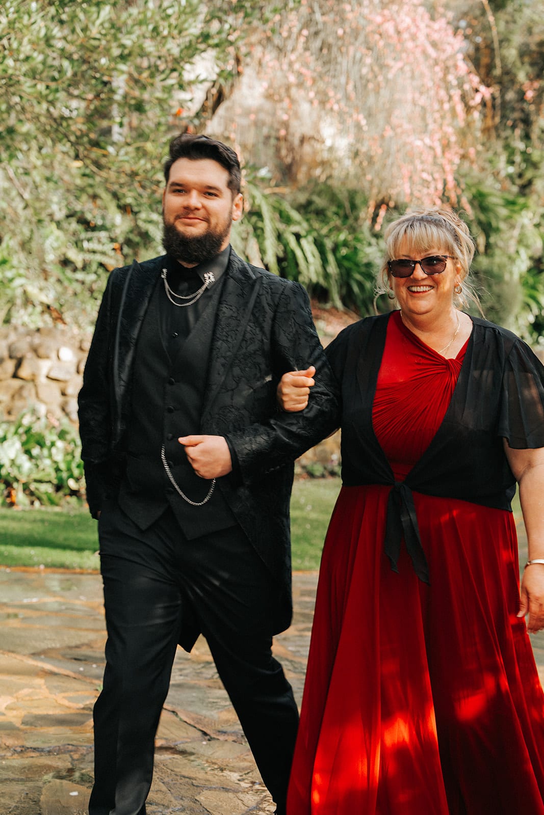 Jordan walking down the aisle with his mum on his arm